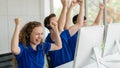 Customer service and call center agents show exited and happy with fists up for being success in project implementing at customer Royalty Free Stock Photo