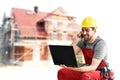 Customer service com craftsmen - workers with telephone and notebook on the construction site