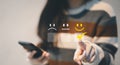 Customer service evaluation concept. woman client pressing smiley face emoticon on virtual touch screen. best rating positive, Royalty Free Stock Photo