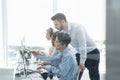 Customer service executive trainer assisting his supervisee at call center office Royalty Free Stock Photo