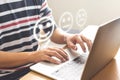 Close-up image of male hands using laptop choose face smile