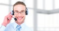 Customer service man with bright background in call center Royalty Free Stock Photo