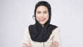 Customer service operator muslim woman in suit wearing headset over white background studio Royalty Free Stock Photo