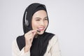 Customer service operator muslim woman in suit wearing headset over white background studio Royalty Free Stock Photo