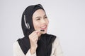 Customer service operator muslim woman in suit wearing headset over white background studio Royalty Free Stock Photo