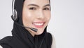 Customer service operator muslim woman in suit wearing headset over white background studio Royalty Free Stock Photo