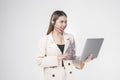 Customer service operator woman in suit wearing headset over white background studio Royalty Free Stock Photo