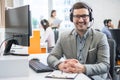 Customer service representative business man with headset in call center. Royalty Free Stock Photo