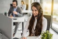 Customer service representative woman in headphones working at modern office. Royalty Free Stock Photo