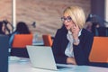 Customer service representative at work. Beautiful young woman in headset working at the computer Royalty Free Stock Photo