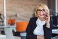 Customer service representative at work. Beautiful young woman in headset working at the computer Royalty Free Stock Photo