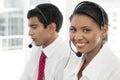 Customer service representatives at work in multiethnic call center Royalty Free Stock Photo