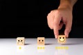 Customer service and Satisfaction feedback concept ,Business people show feedback with smile face wood cube happy Smiley face icon Royalty Free Stock Photo