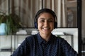 Pleasant young indian woman in headset look at web camera Royalty Free Stock Photo