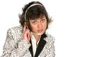 Customer service tech listens over her headset Royalty Free Stock Photo