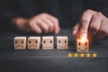 Customer services best excellent business rating experience. Satisfaction survey concept. Hand of a businessman chooses a smiley f Royalty Free Stock Photo
