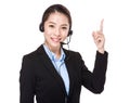 Customer services operator and finger point up Royalty Free Stock Photo