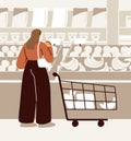 Customer with shopping cart, trolley in supermarket. Consumer choosing, buying fruits in grocery store, greengrocery