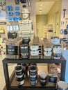 Customer shopping for Large collection of rambler, mug, tumbler, beverage bucket on display at Yeti retail in downtown, ice chests