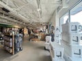 Customer shopping for Large collection of rambler, mug, tumbler, beverage bucket on display at Yeti retail in downtown, ice chests