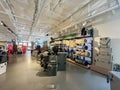 Customer shopping for Large collection of rambler, mug, tumbler, beverage bucket on display at Yeti retail in downtown, ice chests