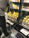 Filipstad/VÃÂ¤rmland/Sweden,January,03.2020-Customer stands in front of baked goods shelf and packs rolls in a Swedish supermarket