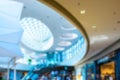 Customer store blurred background. People shopping in modern commercial mall center. Interior of retail centre store in soft focus Royalty Free Stock Photo