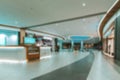 Customer store blurred background. People shopping in modern commercial mall center. Interior of retail centre store in soft focus Royalty Free Stock Photo