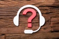 Customer Support Concept Headphones And Question Mark Royalty Free Stock Photo