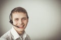 Customer support operator with a headset on white background Royalty Free Stock Photo