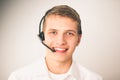 Customer support operator with a headset on white background Royalty Free Stock Photo
