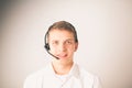 Customer support operator with a headset on white background Royalty Free Stock Photo