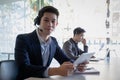 Customer support operator team with hands-free headset working in the office. Royalty Free Stock Photo