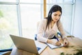 Customer support operator working in a call center office with laptop Royalty Free Stock Photo