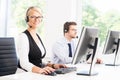 Customer support operators in formalwear working in a call center Royalty Free Stock Photo