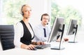 Customer support operators in formalwear working in a call center Royalty Free Stock Photo