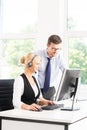 Customer support operators in formalwear working using computers Royalty Free Stock Photo