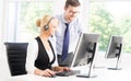 Customer support operators in formalwear working using computers Royalty Free Stock Photo