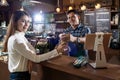 Customer take coffee from Barista