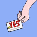 Customer want to buy and say yes to salesperson. Image of a hand purchasing with credit card fom the upper right corner