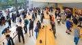 Customers browsing the latest Apple products inside the Apple Store, San Francisco, California.