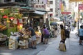 Customers buy fruits and vegetables in a street grocery shop in Hong Kong. Royalty Free Stock Photo