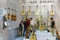 Customers buy guitars in the musical instruments