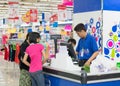 Customers buying food at Coopmart supermarket