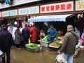 customers buying food at vegetable market in Wuhan city china