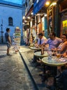 Customers at cafe tables on a Montmartre evening, Paris, France