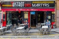 Customers checking their mobile phones as they wait in the improbably-named Bistro des Martyrs in Montmarte, Paris Royalty Free Stock Photo