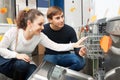 Customers choosing new dish washing machine Royalty Free Stock Photo