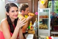 Customers eating Hotdog in fast food snack bar Royalty Free Stock Photo
