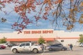 Customers enter Home Depot entrance with fall foliage in autumn Royalty Free Stock Photo